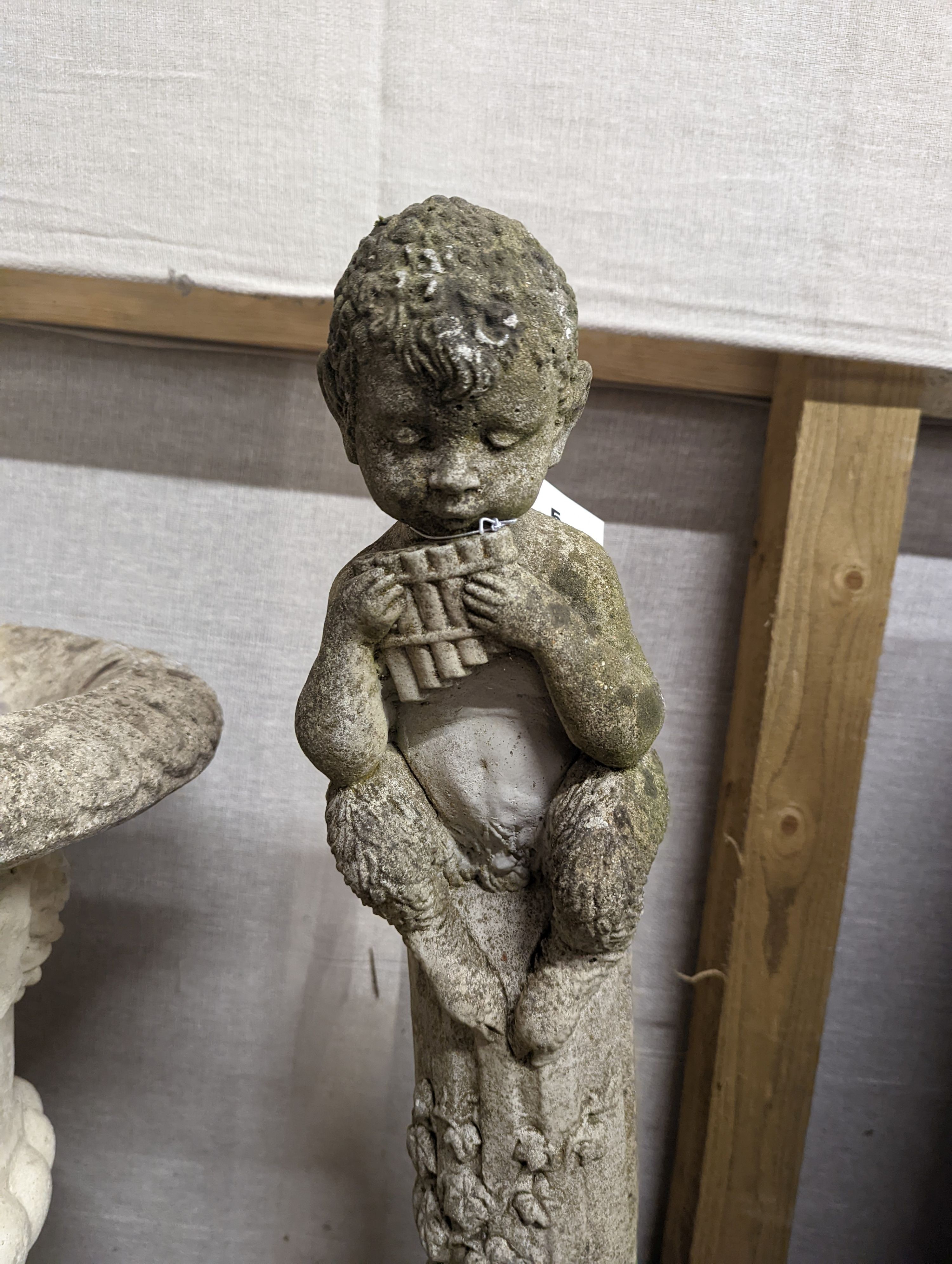 A reconstituted stone garden ornament of pan, height 82cm